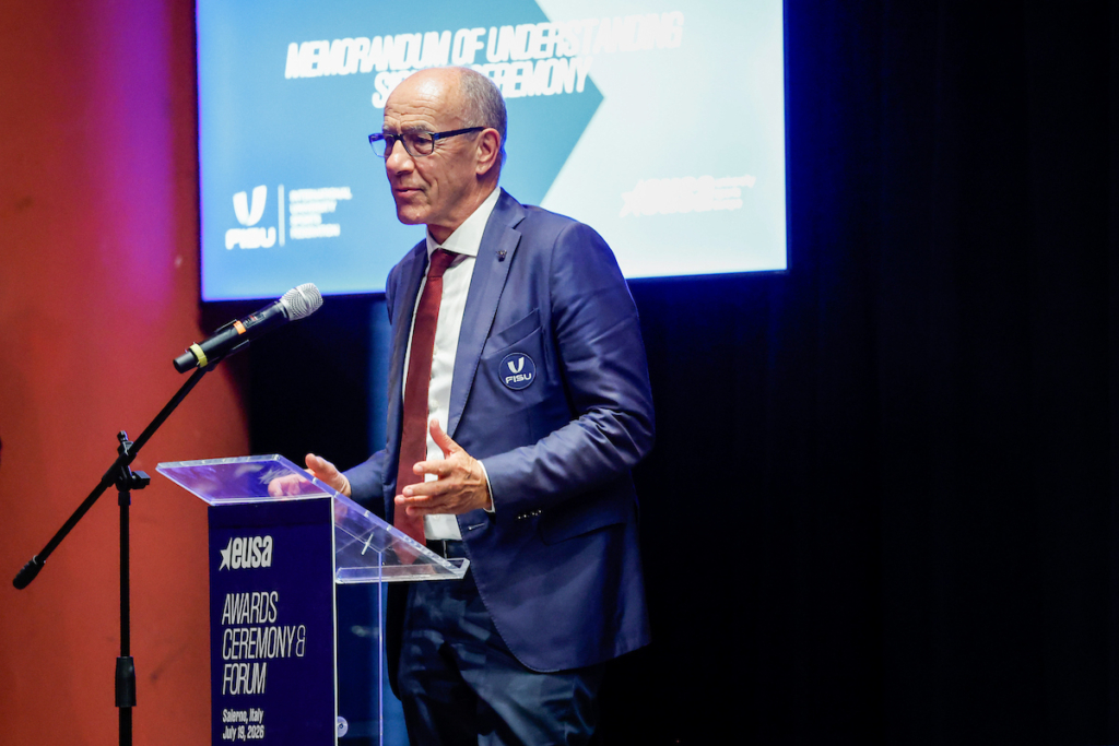 A person in a suit speaks at a podium during the EUSA Awards Ceremony & Forum in Salerno, Italy, on July 13, 2026.